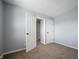 Bedroom featuring carpet, gray walls and doors that open into other rooms at 6629 N 600 W, Fairland, IN 46126