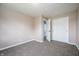 Bedroom featuring carpet, a double door closet and an open doorway to another room at 6629 N 600 W, Fairland, IN 46126