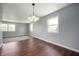 Dining room featuring hardwood floors, fresh paint, and natural lighting at 6629 N 600 W, Fairland, IN 46126