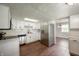 Modern kitchen with stainless steel appliances, subway tile backsplash, and wood-look flooring at 6629 N 600 W, Fairland, IN 46126