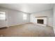 Spacious living room featuring a brick fireplace and neutral carpeting at 6629 N 600 W, Fairland, IN 46126