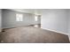 Spacious living room with neutral carpet, abundant natural light, and gray walls at 6629 N 600 W, Fairland, IN 46126