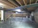 Unfinished basement with exposed beams, concrete floor, and ample space for customization at 7027 Pinnacle Dr, Columbus, IN 47201