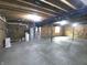 Unfinished basement with exposed beams, concrete floor, and utilities at 7027 Pinnacle Dr, Columbus, IN 47201