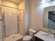 Bathroom featuring a walk-in shower, toilet, and single sink vanity at 7027 Pinnacle Dr, Columbus, IN 47201