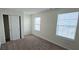 Bright bedroom with carpet floors, closet, and two windows for lots of natural light at 7027 Pinnacle Dr, Columbus, IN 47201