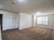 Spacious bedroom featuring plush carpeting, neutral walls, and natural light from a large window at 7027 Pinnacle Dr, Columbus, IN 47201