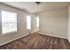 Bright bedroom with two windows, plush carpeting, and a neutral color palette at 7027 Pinnacle Dr, Columbus, IN 47201