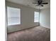 Bedroom with two large windows, a ceiling fan, and plush carpeting at 7027 Pinnacle Dr, Columbus, IN 47201