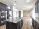 Spacious kitchen with granite countertops, stainless steel appliances, and dark wood cabinetry at 7027 Pinnacle Dr, Columbus, IN 47201
