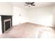 Bright, open living room with fireplace and neutral carpet flooring, perfect for entertaining at 7027 Pinnacle Dr, Columbus, IN 47201