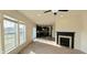Open-concept space with fireplace, leading to the modern kitchen and backyard at 7027 Pinnacle Dr, Columbus, IN 47201