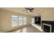 Bright living room offering a fireplace, neutral walls and lots of natural sunlight at 7027 Pinnacle Dr, Columbus, IN 47201
