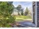 The grassy yard features mature landscaping and a patio at 7459 Quincy Ct, Indianapolis, IN 46254