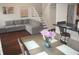 Cozy living room with staircase, dining area, and comfortable seating arrangement at 7459 Quincy Ct, Indianapolis, IN 46254