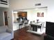Open-concept living area with a kitchen bar, dining table, and comfortable seating space at 7459 Quincy Ct, Indianapolis, IN 46254