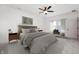 Serene main bedroom featuring a king-sized bed, soft lighting, neutral decor, and large windows at 780 James William Ln, Westfield, IN 46074