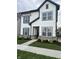 Charming two-story home with white siding, gray trim, and manicured front yard at 780 James William Ln, Westfield, IN 46074