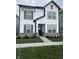 Beautiful two-story home with gray trim, a covered porch and lovely landscaping at 780 James William Ln, Westfield, IN 46074