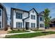 Charming two-story home with white siding, gray trim, a well-manicured lawn and attractive curb appeal at 780 James William Ln, Westfield, IN 46074