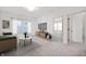 Inviting living room with a neutral palette, modern furniture, and large windows offering ample natural light at 780 James William Ln, Westfield, IN 46074