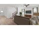 Comfortable living room with stylish furniture, a modern ceiling fan, and stairs leading to the upper level at 780 James William Ln, Westfield, IN 46074