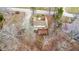 An aerial view of a charming stone house with a deck surrounded by trees and greenery at 8937 W 800 N, Indianapolis, IN 46259