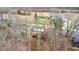 Aerial view of a home with wooden deck surrounded by lush trees and greenery at 8937 W 800 N, Indianapolis, IN 46259