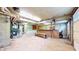 Large basement with garage door with exposed mechanical and unfinished walls at 8937 W 800 N, Indianapolis, IN 46259