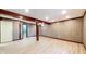 Unfinished basement with wood-paneled walls and neutral-toned flooring at 8937 W 800 N, Indianapolis, IN 46259
