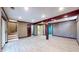 Spacious basement featuring wood beams and wood-paneled walls at 8937 W 800 N, Indianapolis, IN 46259