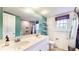 Bathroom featuring double vanity, large mirror, and shiplap accent wall at 8937 W 800 N, Indianapolis, IN 46259