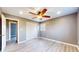 Bedroom featuring gray vinyl floors, ceiling fan and closet at 8937 W 800 N, Indianapolis, IN 46259