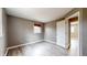 Neutral bedroom with luxury vinyl plank flooring and light-filled window at 8937 W 800 N, Indianapolis, IN 46259