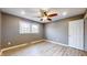 Bedroom featuring gray vinyl floors, ceiling fan and a large window at 8937 W 800 N, Indianapolis, IN 46259