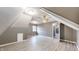 Bonus room featuring modern gray vinyl floors and a ceiling fan at 8937 W 800 N, Indianapolis, IN 46259