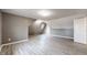 Spacious bonus room featuring modern gray vinyl floors and a skylight at 8937 W 800 N, Indianapolis, IN 46259