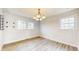 Dining room with light wood floors, white walls and a modern light fixture at 8937 W 800 N, Indianapolis, IN 46259