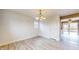 Open-concept dining room featuring wood floors and a view of the outdoor deck at 8937 W 800 N, Indianapolis, IN 46259