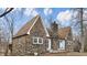 Charming stone house with a chimney and walkway surrounded by trees at 8937 W 800 N, Indianapolis, IN 46259