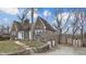 Charming stone home with a well-manicured lawn, featuring a shed and multi-car garage at 8937 W 800 N, Indianapolis, IN 46259