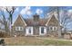Charming stone home featuring a unique chimney design and two entry doors at 8937 W 800 N, Indianapolis, IN 46259