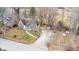 Charming stone home with a well-manicured lawn, featuring a shed and stone chimney at 8937 W 800 N, Indianapolis, IN 46259