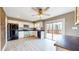 Bright kitchen with stainless steel appliances, white cabinets, and a ceiling fan at 8937 W 800 N, Indianapolis, IN 46259