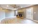 Cozy living room featuring a stone fireplace and ample natural light at 8937 W 800 N, Indianapolis, IN 46259
