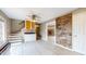 Open-concept living room with a wooden accent wall and stairs leading to a second floor at 8937 W 800 N, Indianapolis, IN 46259