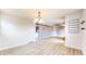 Spacious living room with modern wood flooring and a stylish light fixture at 8937 W 800 N, Indianapolis, IN 46259