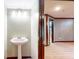 Small powder room with pedestal sink adjacent to finished basement at 8937 W 800 N, Indianapolis, IN 46259