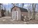 Storage shed featuring double doors located in the backyard of the property at 8937 W 800 N, Indianapolis, IN 46259
