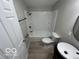Modern bathroom showcasing a sleek sink and a shower-tub combination at 1007 N 10Th St, Elwood, IN 46036